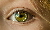 Grünes Auge mit Uhr Grünes Auge mit Uhr